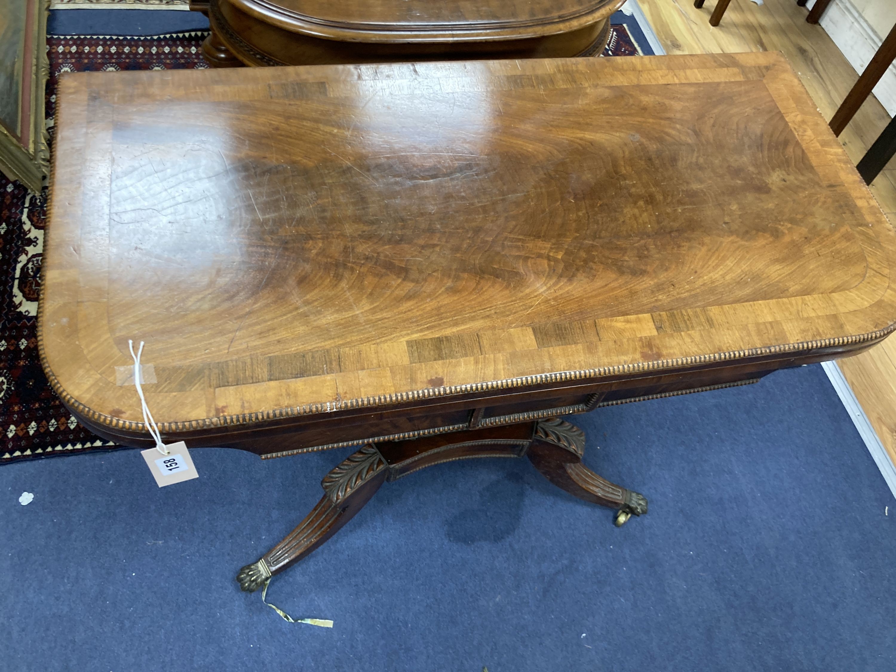 A regency rosewood banded mahogany folding card table. W-90, D-45, H-71cm.